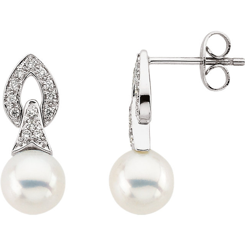 These elegant 14k white gold earrings each feature a 7mm freshwater cultured pearl with diamond accents. Diamonds are 1/6ctw, G-H in color, and I1 or better in clarity.