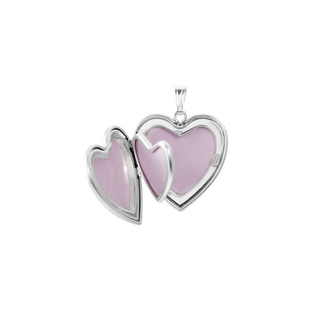 A sweet look, this locket is perfect for the one you love. Heart Locket With Cross In Sterling Silver. Polished to a brilliant shine.