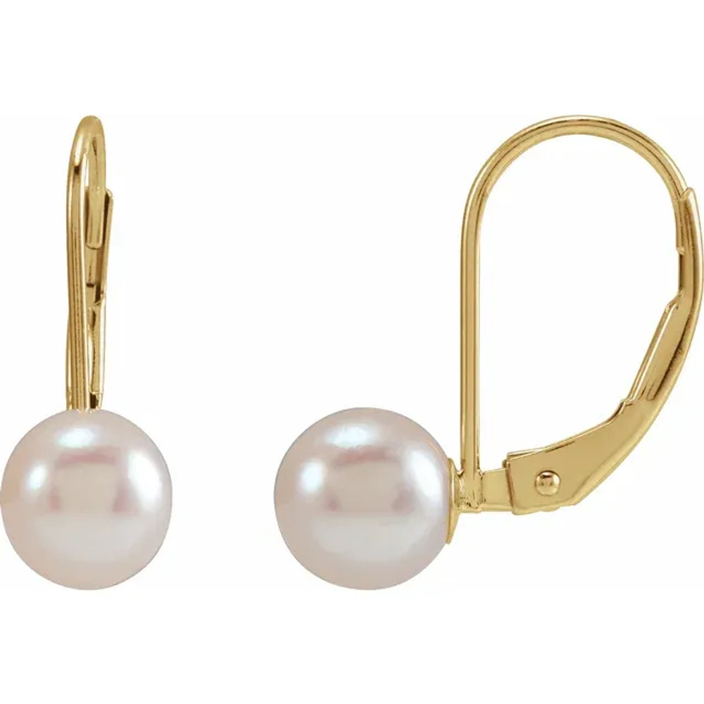 With ease and elegance, these pearl drop earrings complete her tailored anytime attire.