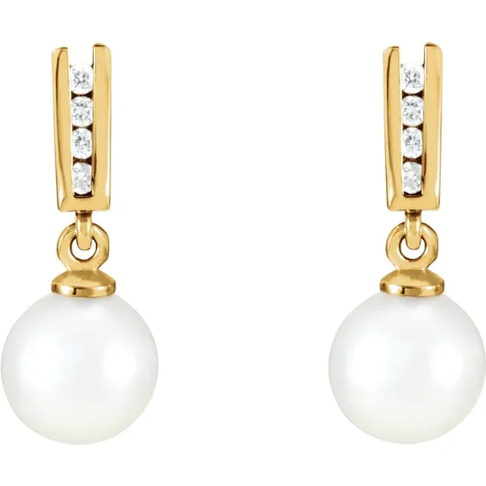 With ease and elegance, these classic pearl drop earrings complete her tailored anytime attire.