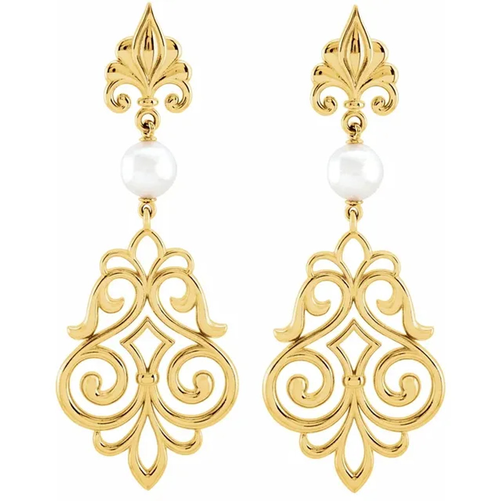 With ease and elegance, these pearl drop earrings complete her tailored anytime attire.