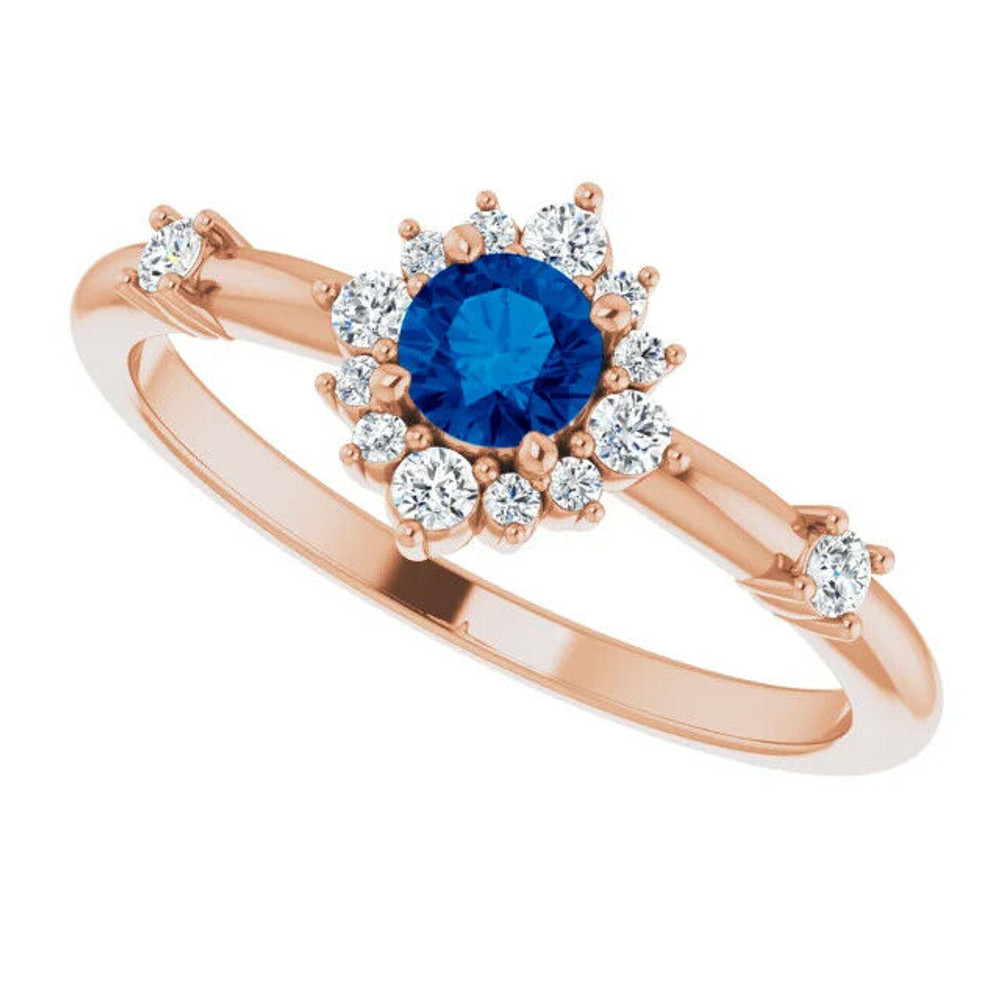 Take your look to the next sophisticated level when you wear this charming round-shaped blue sapphire and diamond ring in white gold.