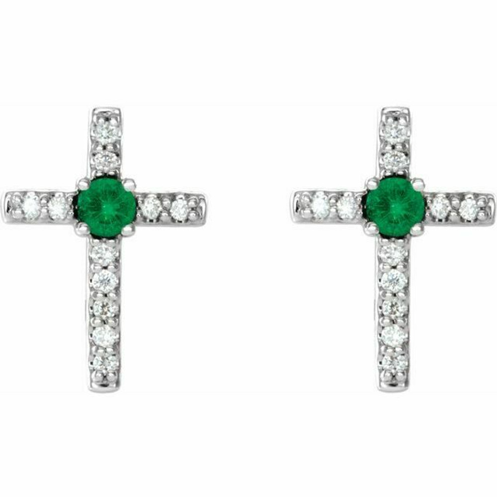 Adorn yourself with these stunning cross earrings featuring natural emerald and 0.05 carat total weight of natural diamonds.
