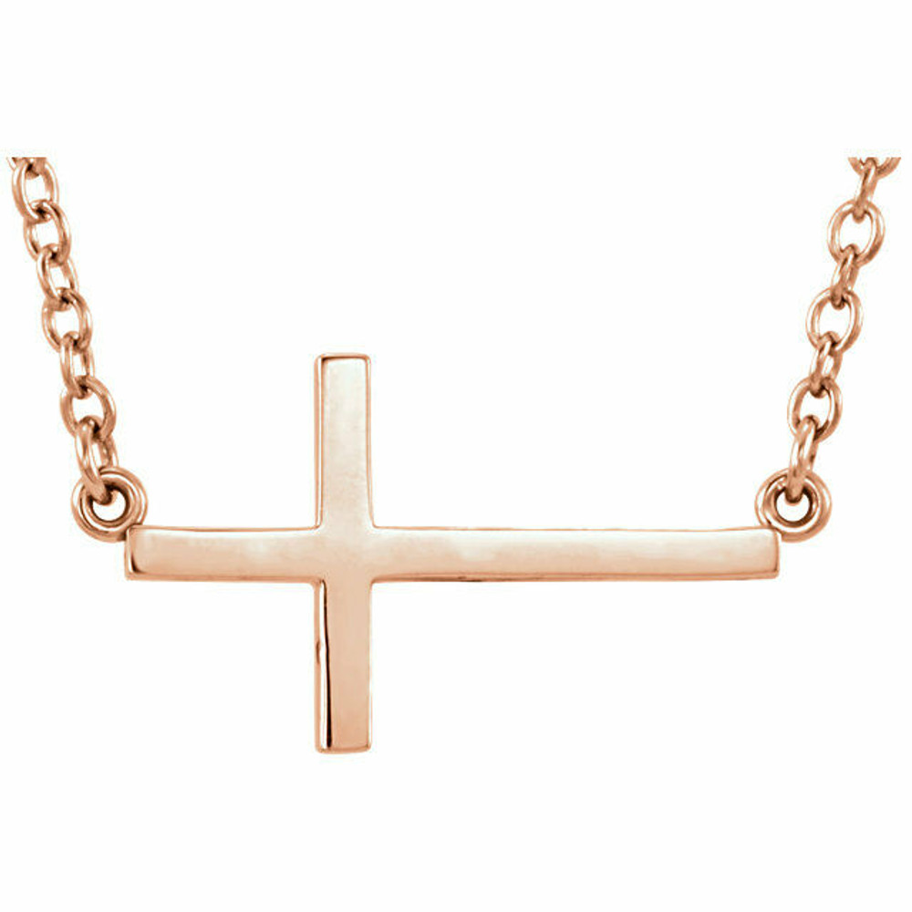 Simple and stylish, this sideways cross necklace is as much about faith as it is fashion. Crafted in warm 14K rose gold, this necklace features a small traditional cross turned on its side and slightly offset along a polished link chain. A thoughtful design, the chain measures 16.0 inches in length with a 2.0-inch extender and it secures with a spring-ring clasp. 