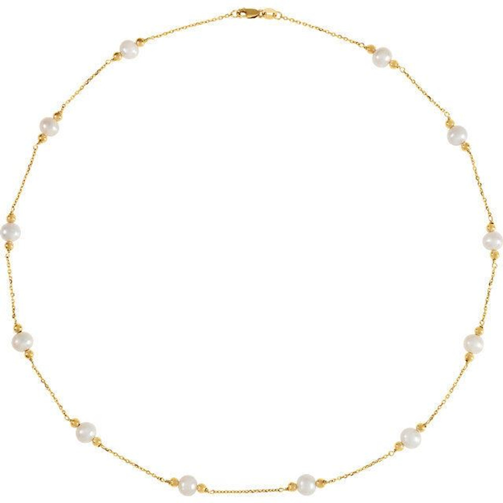 This "Tin Cup" pearl necklace, a style made famous by Rene Russo in the feature film of the same name, features lustrous freshwater cultured pearls stationed along a 14k yellow gold cable chain. A delicate twist on a time-honored pearl necklace that makes a great first pearl purchase or a beautiful bridesmaid gift.