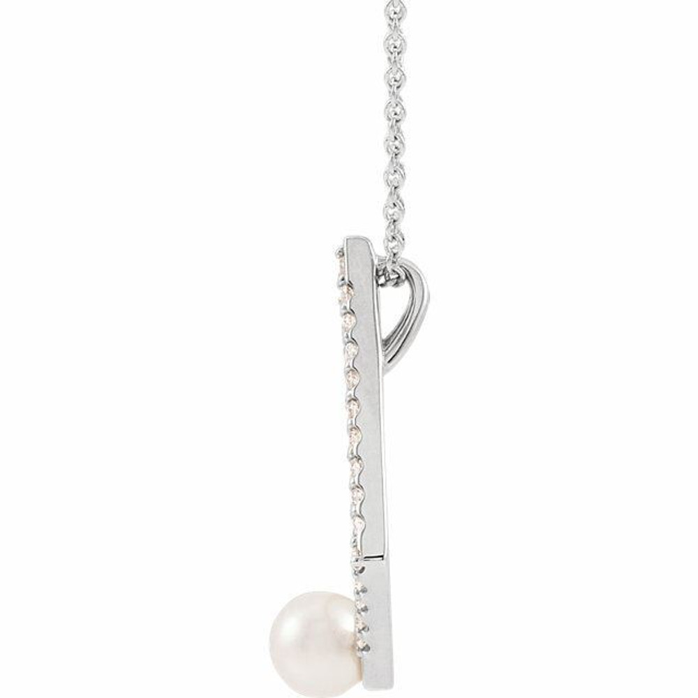 Make a bold and modern fashion statement with this cultured freshwater pearl & Diamond Geo Pendant Necklace in a geometric-shaped sterling silver design showcased by 29 sparkling accent diamonds set off by a singular freshwater cultured freshwater pearl.

Cultured freshwater pearls measure approximately 5mm to 5.5mm in diameter. Diamonds are rated I1 for clarity, G-H for color, with a 0.25 total carat weight.

This distinctive pendant comes suspended on a sterling silver chain, secured with a ring clasp. 