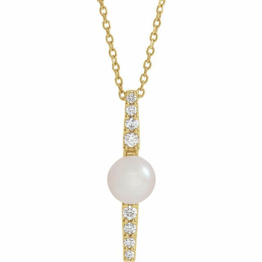 Make a bold and modern fashion statement with this cultured freshwater pearl & Diamond Pendant Necklace in 14k yellow gold showcased by 8 sparkling accent diamonds set off by a singular freshwater cultured freshwater pearl.

Cultured freshwater pearls measure approximately 6mm to 6.5mm in diameter. Diamonds are rated I1 for clarity, G-H for color, with 1/6 total carat weight.

This distinctive pendant comes suspended on a 14k yellow gold chain in your choice of lengths (16" or 18"), secured with a ring clasp. 