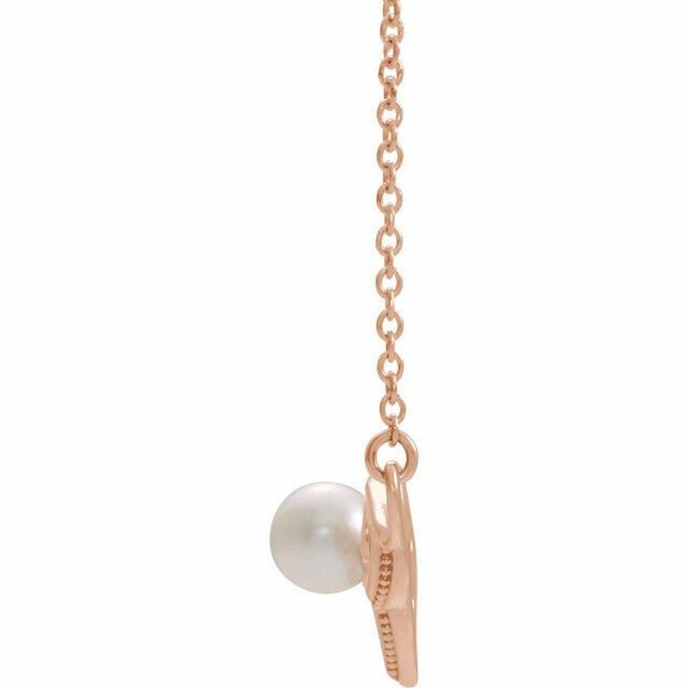 Make a bold and modern fashion statement with this cultured freshwater pearl vintage-inspired bar necklace in 14k rose gold.

Cultured freshwater pearl measure approximately 4.5mm to 5mm in diameter.

This distinctive pendant comes suspended on a 14k rose gold chain in your choice of lengths (16" or 18"), secured with a ring clasp. Just send us a message and let us know if you want a 16 or a 18 inch chain.

The pendant necklace is also available in other metals.