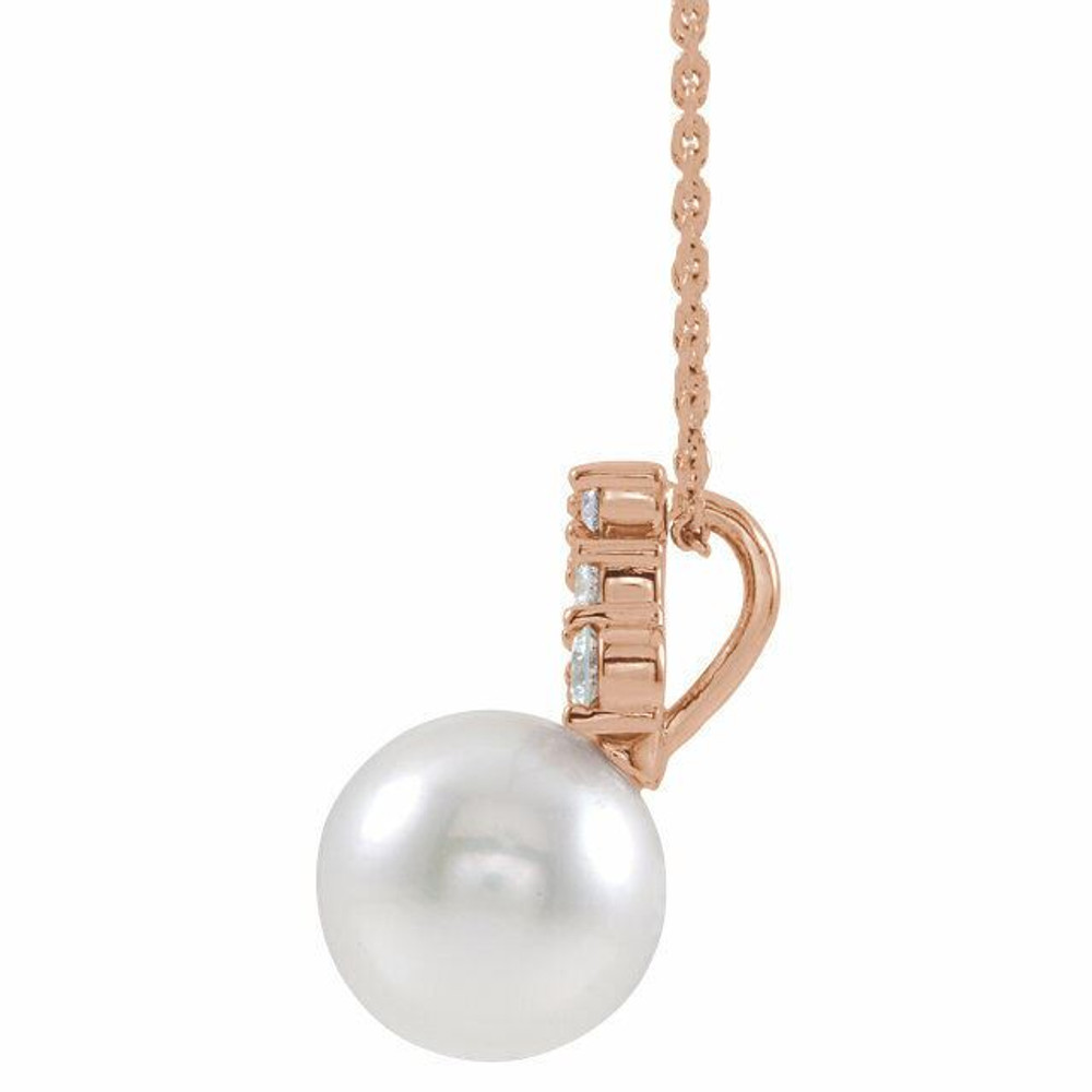 Our highest-quality Freshwater cultured pearl is paired with five brilliant round diamonds and attached to an 14k rose gold bail. The pair suspend from a delicate 14k rose gold 16-18" cable chain. Diamonds are G-H in color and I1 or better in clarity. 