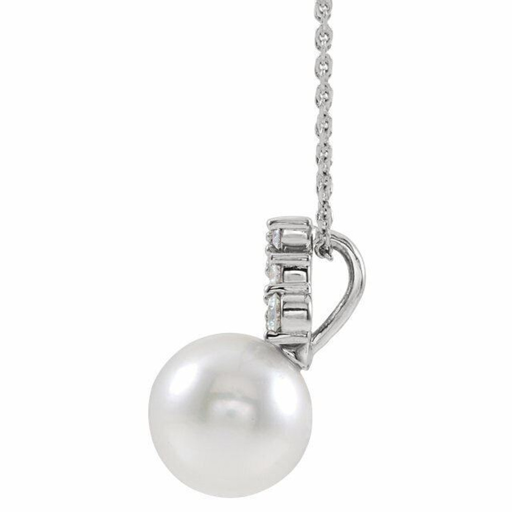 Our highest-quality Freshwater cultured pearl is paired with five brilliant round diamonds and attached to an sterling silver bail. The pair suspend from a delicate sterling silver 16-18" cable chain. Diamonds are G-H in color and I1 or better in clarity. 