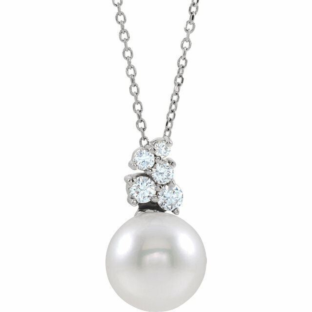 Our highest-quality Freshwater cultured pearl is paired with five brilliant round diamonds and attached to an platinum bail. The pair suspend from a delicate platinum 16-18" cable chain. Diamonds are G-H in color and SI2 or better in clarity. 