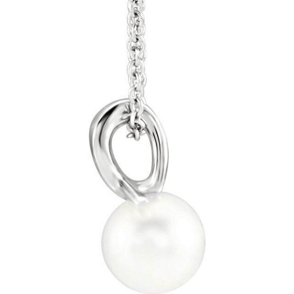 This Freshwater cultured pearl, attached to an sterling silver bail, suspends from a delicate sterling silver cable chain. Perfect for wearing alone or layering it with other pieces, it is suspended from a matching cable chain that can fasten at 16 or 18 inches. 