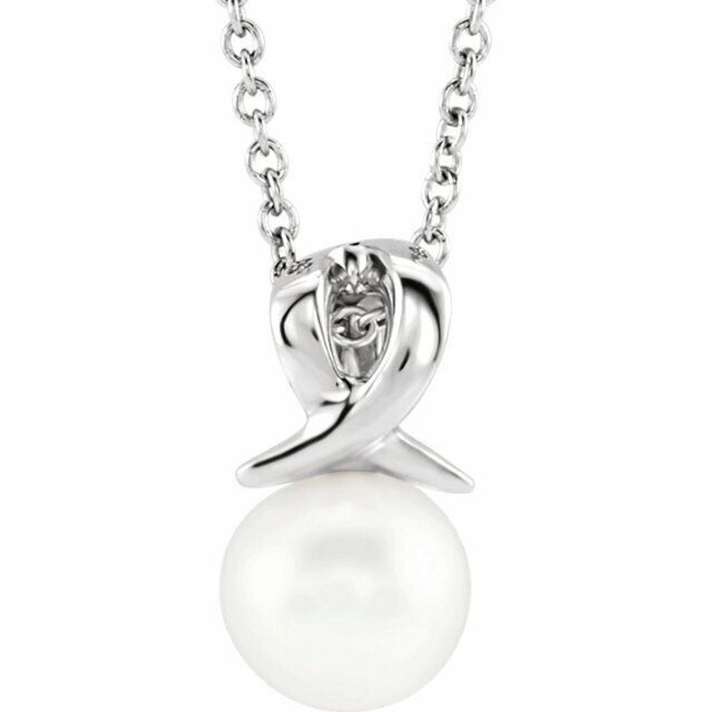 This Freshwater cultured pearl, attached to an 14k white gold bail, suspends from a delicate 14k white gold cable chain. Perfect for wearing alone or layering it with other pieces, it is suspended from a matching cable chain that can fasten at 16 or 18 inches. 