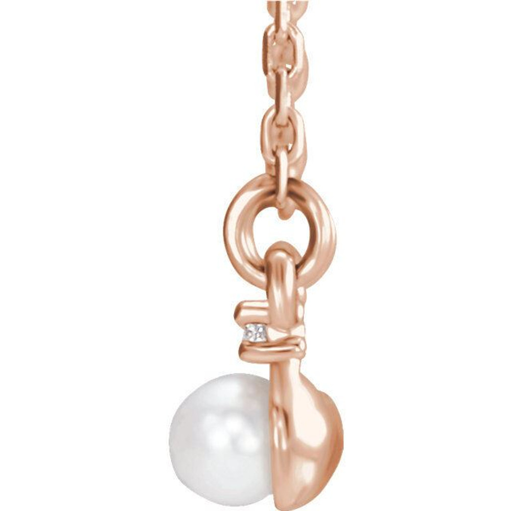 You shouldn't have to choose between diamonds and pearls. Here, a gleaming row of four 3mm cultured freshwater pearls is bordered by a slim bar of .06 ct. t.w. diamonds set in polished 14kt rose gold.