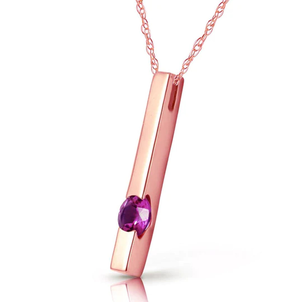 This 14k rose gold necklace with natural purple amethyst is a modern piece that has a drop of feminine color to give it a stylish and colorful look. A classic gold bar is suspended effortlessly from an 18 inch rope chain. The golden pendant has a unique and modern look that is not over the top. One beautiful glowing amethyst stone adds a splash of color to the dazzling gold, with a weight of .25 carat that is not overwhelming. This necklace makes a great piece for the trendsetter who celebrates her birthday in the month of February.