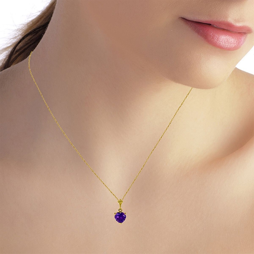 Give her your heart with this fabulous 14k solid gold necklace with natural purple amethyst. This universal symbol of love is the main feature of this simply elegant necklace. An 18 inch rope chain is used to show off the stunning deep purple heart shaped amethyst. The stone, which weighs over one full carat, reflects shine and radiance to make this a stunning necklace that will coordinate beautifully with any outfit. This necklace also makes a great gift for any lady celebrating a birthday in February.