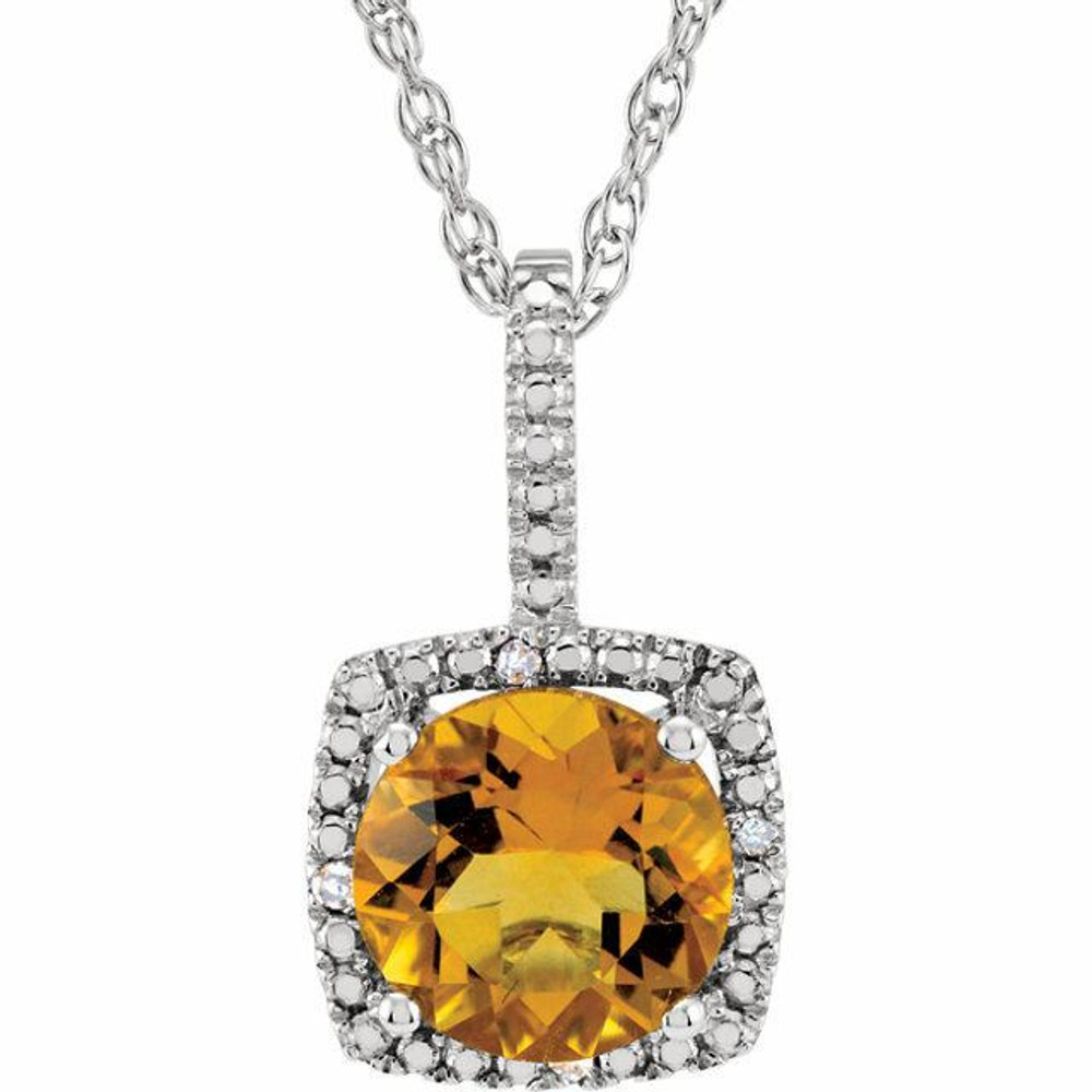 Celebrate her November birthday with this timeless fashion pendant. Created in sleek sterling silver, the eye is drawn to the 7.0mm round-cut citrine center stone. A border of shimmering .015 ct. tw. round diamonds wraps the center stone in a sparkling embrace, completing the look. Polished to a brilliant shine, this pendant suspends along an 18.0-inch chain that secures with a spring-ring clasp.