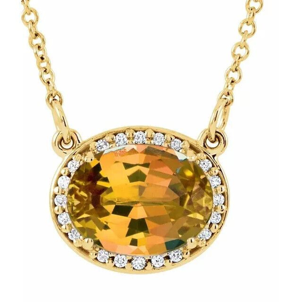 Dynamic style is found in this 14Kt yellow gold pendant featuring a 9 x 7mm oval shaped genuine citrine in the center surrounded by shimmering white diamonds. Total weight of the diamonds is 0.05ct. 