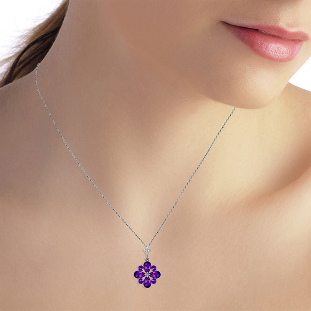 Instead of a bouquet, try giving your loved one a gorgeous floral necklace made of high quality white gold and beautiful genuine gemstones. This 14k white gold necklace with natural purple amethysts is an amazing piece that showcases the beauty of a flower that is always in bloom.

Four round cut and four pear cut amethysts glow brightly to form the beautiful pendant, which contains over two carats of stunning natural gems. The flower is set in 14k yellow, white, or rose gold and includes a matching 18 inch rope chain that dangles it delicately.