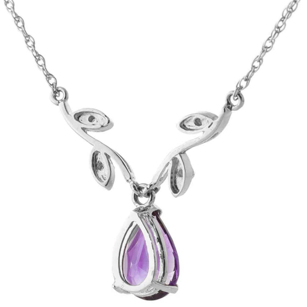 A simple solitaire style necklace is made more eye catching with the addition of stunning details on this 14k white gold necklace with natural diamonds and purple amethysts. An 18 inch double link rope chain crafted in solid 14k yellow, white, or rose gold is used to support a gorgeous vine design.

Four leaves are featured on this design, holding four round cut natural diamonds. This shape is used to accent the dangling pear cut amethyst. The stone weighs 1.50 carats, just the right size for showing off the beauty and glimmering sparkle that this purple stone emits.