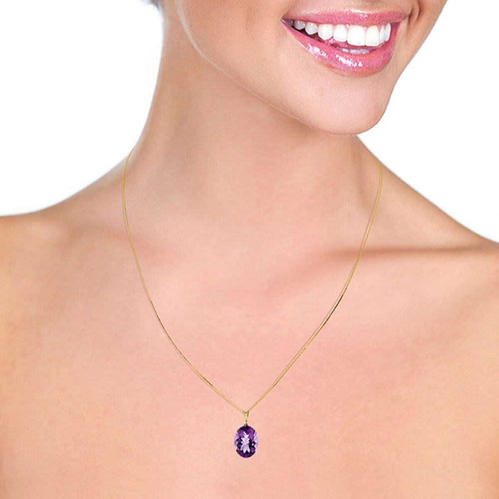 A traditional solitaire pendant featuring a birthstone is a beautiful gift, either for yourself or someone else. Celebrate a February birthday with this fabulous 14k solid gold necklace with oval purple amethyst. This sleek and beautiful necklace keeps things simple by showing off the stunning purple glow of amethyst.

The oval shaped stone measures in at a whopping 7.55 carats, showcasing the true beauty of this amazing stone. The 18 inch box chain is delicate enough to leave the spotlight on this sparkling stone, while also adding the rich luxury of solid 14k gold, available in yellow, white, or rose gold.