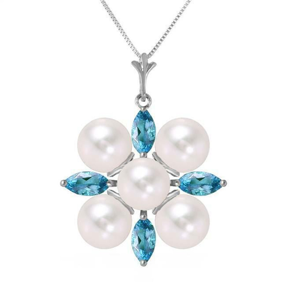  You will look cool and crisp as a winter morning when you wear this 14K. white gold necklace with blue topazes and pearls. A grouping of five glimmering pearls is surrounded by four marquise cut topazes that glitter when the well-crafted facets catch the light. The round pearls measure at 5.00 carat weight and the topazes are 1.30 carats in weight.
 
The pendant measures a little over an inch in height. If you are not buying a necklace for yourself today, consider this beautiful piece for a friend or family member born in June or December.