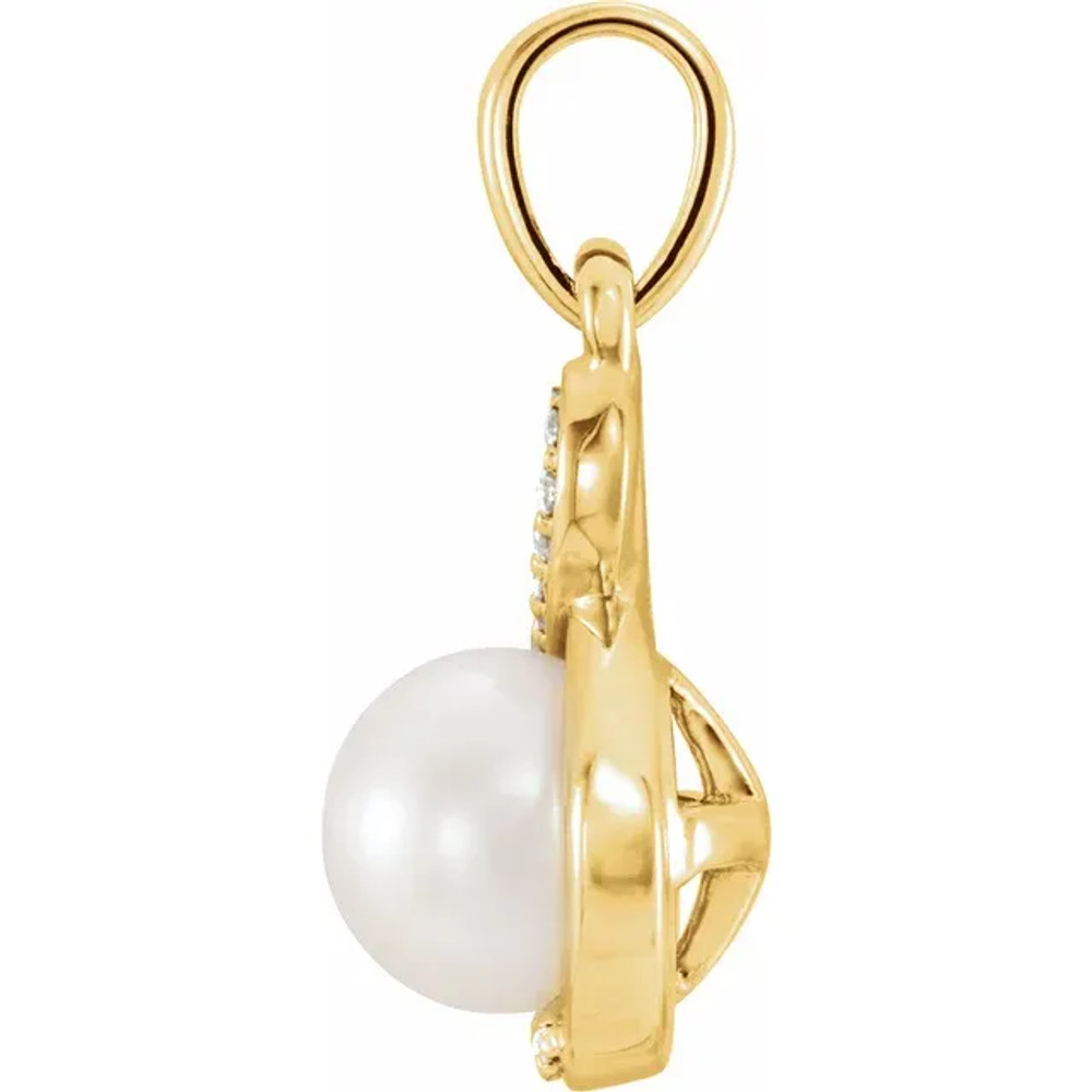 A smart finish to any already-elegant look, this sophisticated pearl and diamond pendant is certain to be adored. Fashioned in 14K yellow gold, this dainty accent piece features an 6.0-6.5mm cultured freshwater pearl with round cut diamonds. Blissful with .07 ct. t.w. of diamonds and a bright polished shine.