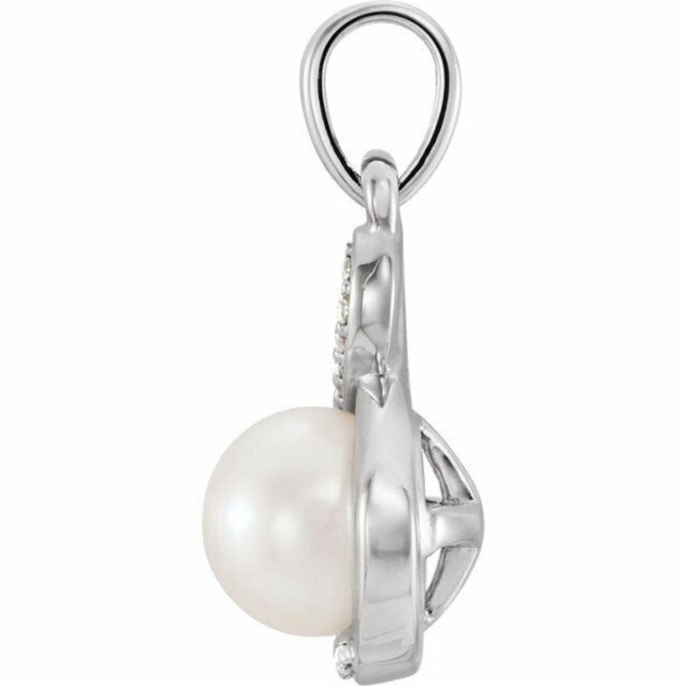 A smart finish to any already-elegant look, this sophisticated pearl and diamond pendant is certain to be adored. Fashioned in sterling silver, this dainty accent piece features an 6.0-6.5mm cultured freshwater pearl with round cut diamonds. Blissful with .07 ct. t.w. of diamonds and a bright polished shine.