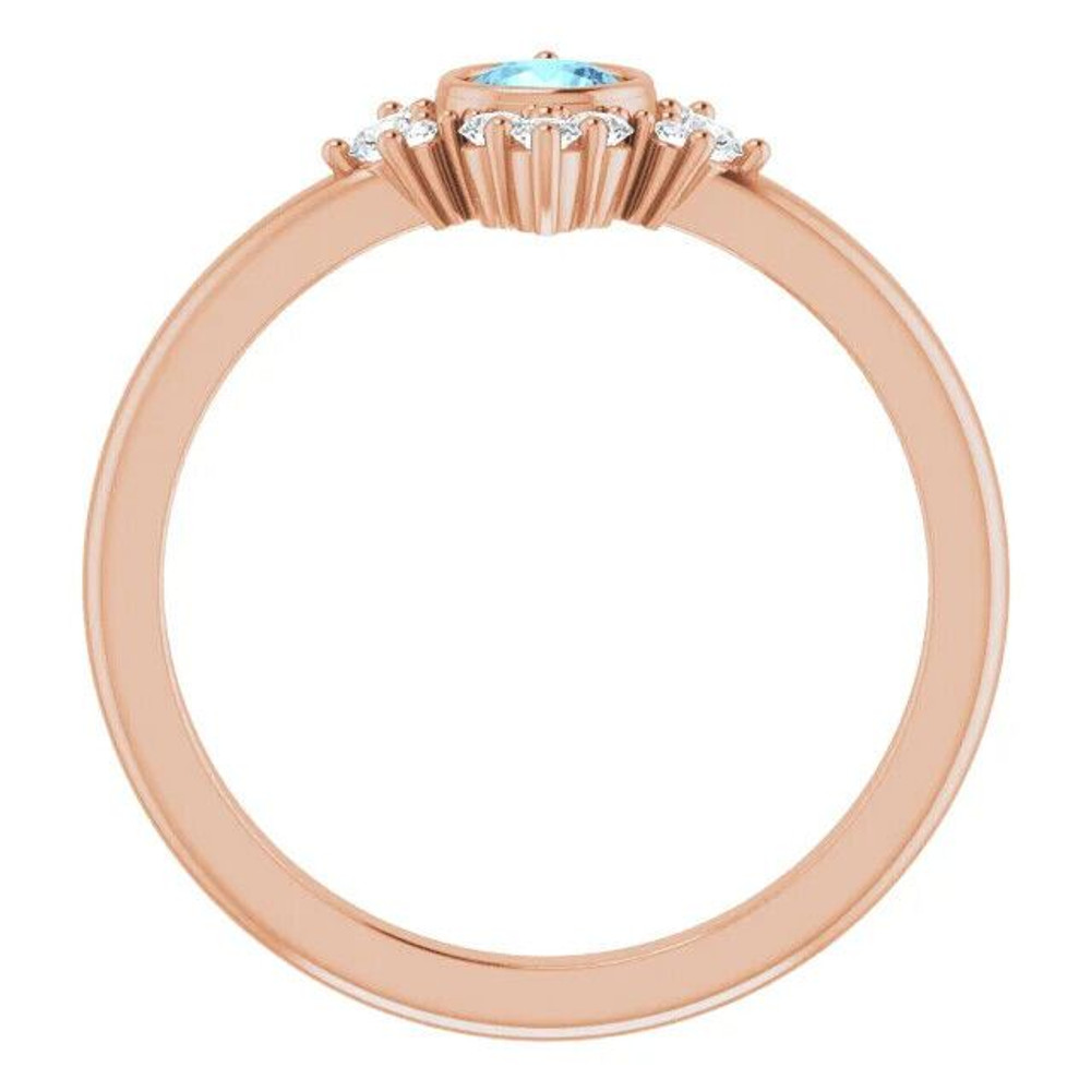 Elegant and vibrant, this round icy-blue aquamarine and diamond ring in 14k rose gold is a beautiful choice to top off all your favorite looks.