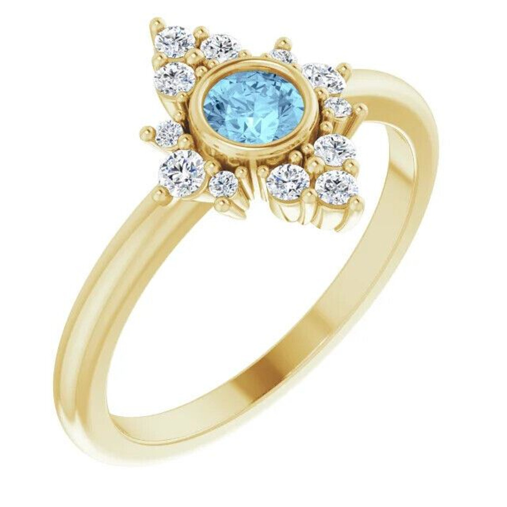 Elegant and vibrant, this round icy-blue aquamarine and diamond ring in 14k yellow gold is a beautiful choice to top off all your favorite looks.