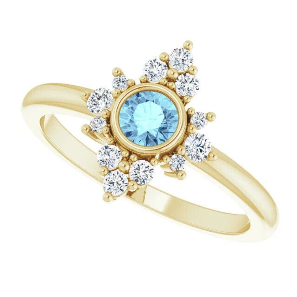 Elegant and vibrant, this round icy-blue aquamarine and diamond ring in 14k yellow gold is a beautiful choice to top off all your favorite looks.