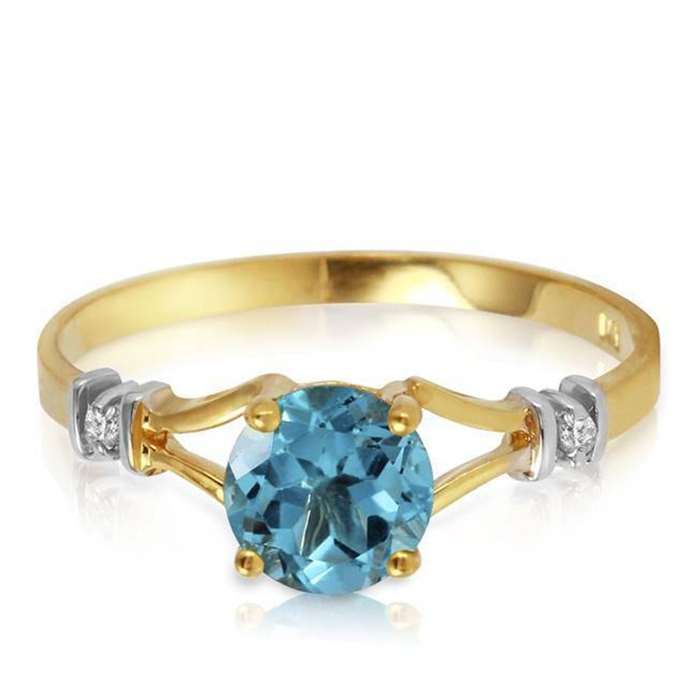 The bright blue color of natural blue topaz has made it a favorite semiprecious gemstone. This 14k solid gold ring with natural diamonds and blue topaz takes advantage of the beauty of this gem by keeping the design simple. The true focus of this stunning ring is the traditional round cut blue topaz center stone, which is a whopping one carat. Openings in the band offer a unique look while keeping the ring simple. Two round cut natural diamonds are set within the band to emphasize the beauty of the blue topaz. This ring makes a beautiful birthstone ring for ladies with a January birthday, although anyone who appreciates fine jewelry will adore this beauty.