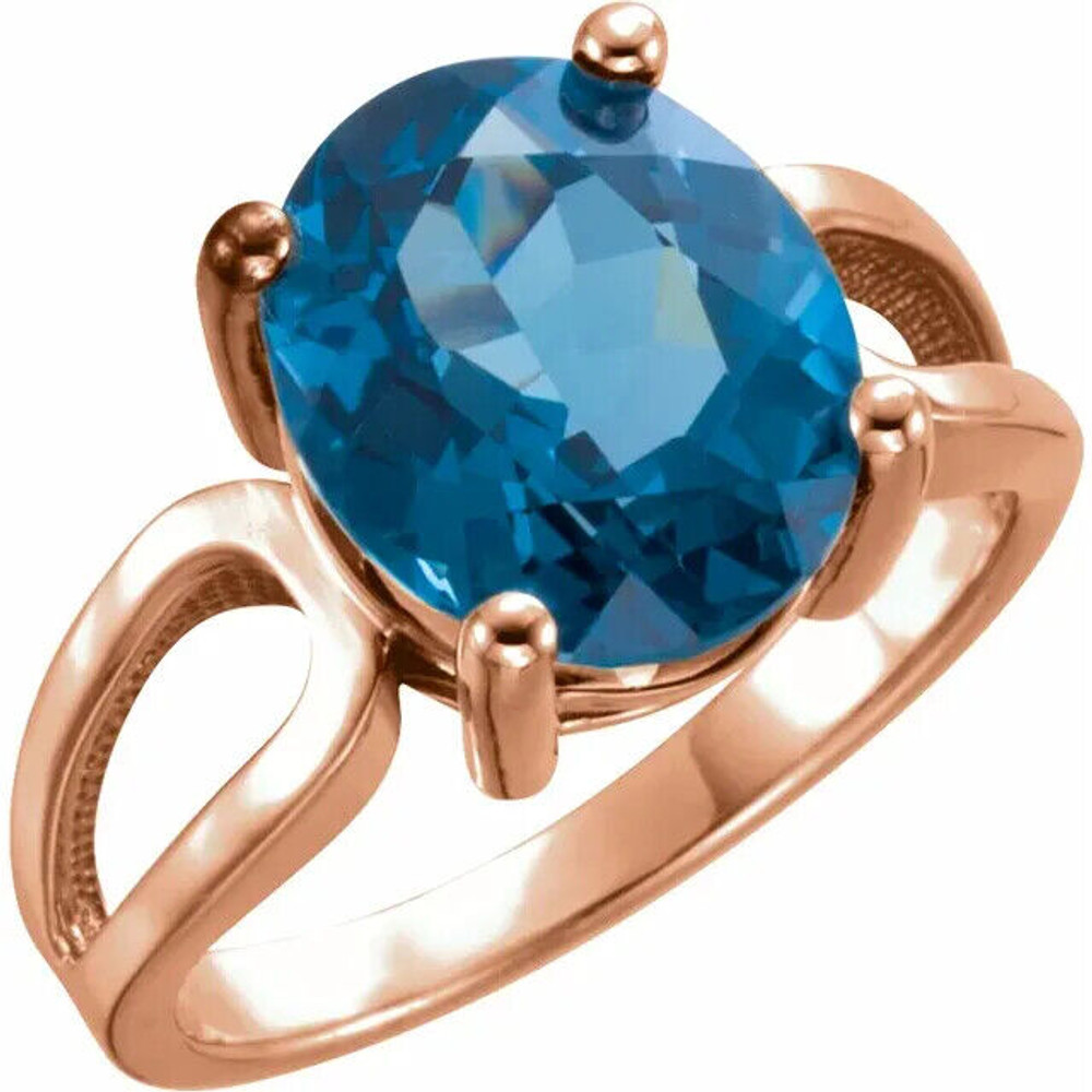 Adorn your fingers with this exquisite 14K Rose ring featuring a stunning 12x10 mm natural London blue topaz.