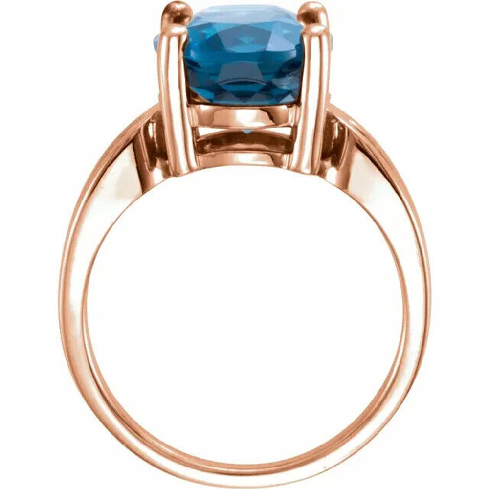 Adorn your fingers with this exquisite 14K Rose ring featuring a stunning 12x10 mm natural London blue topaz.