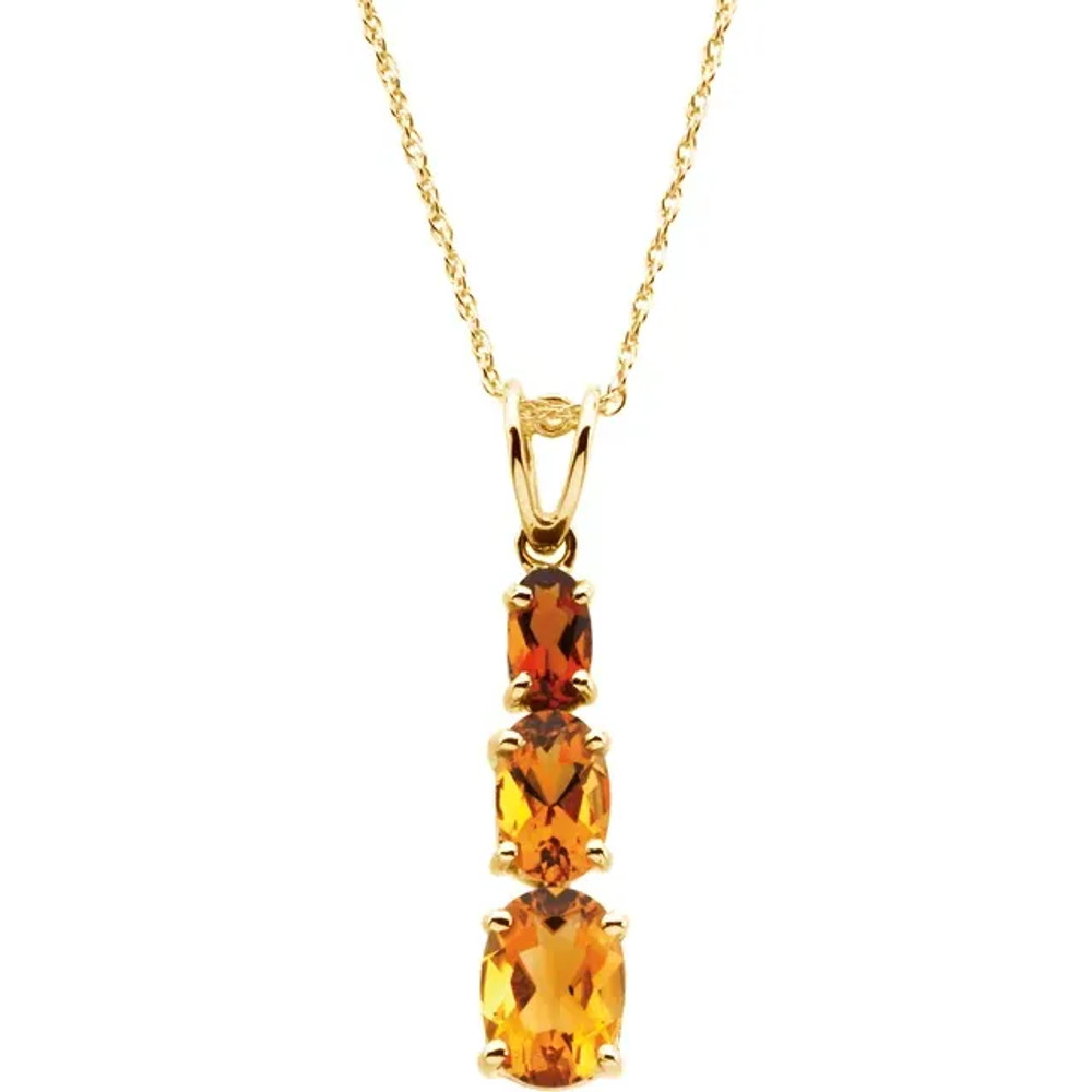 This beautiful, multi-color pendant features three, genuine citrine gemstones, graduated in size and prong set in high-polished 14K yellow gold. The top stone, a genuine madeira citrine, is medium to dark brownish orange. The middle and lower stones range from medium gold to slightly orange. The faceted, oval-shaped stones have a good cut and a combined weight of 1.31 carats.