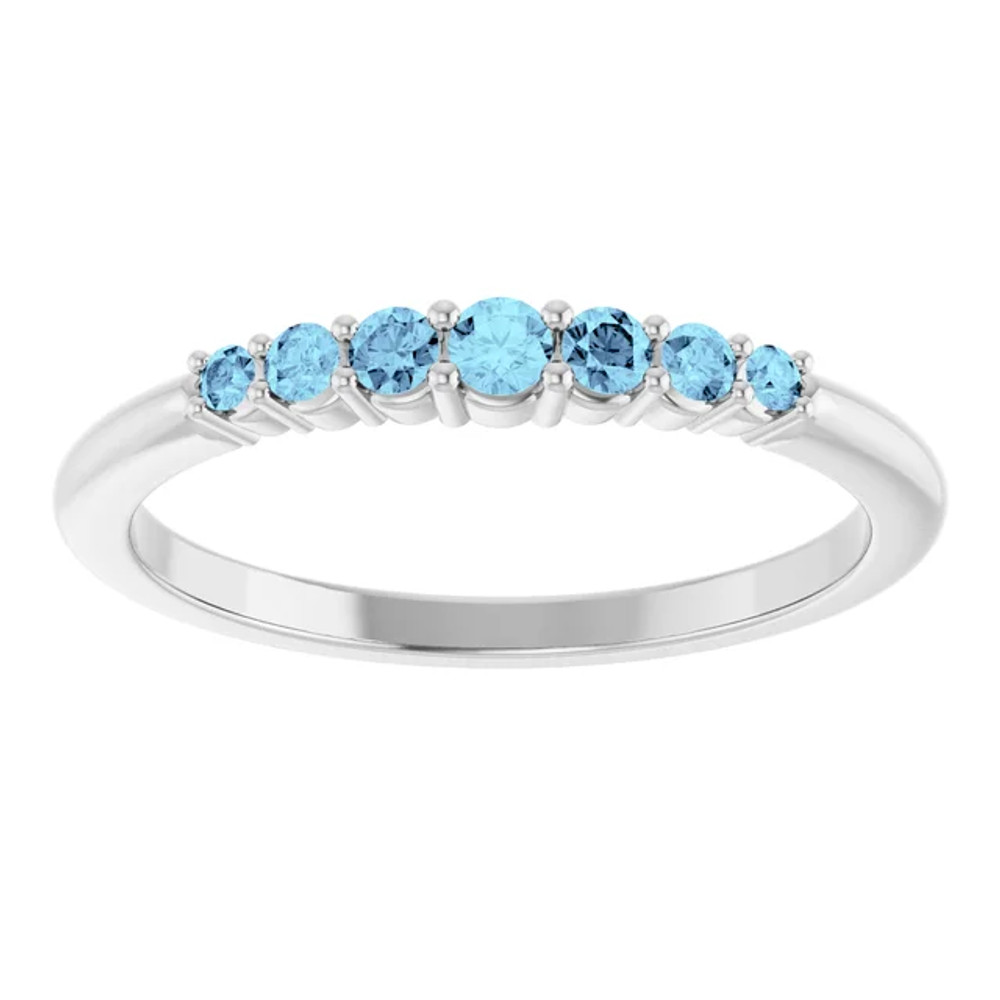 Dainty and feminine, this gemstone ring sets an elegant tone. The ring is set in platinum.