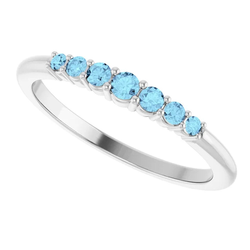 Dainty and feminine, this gemstone ring sets an elegant tone. The ring is set in platinum.
