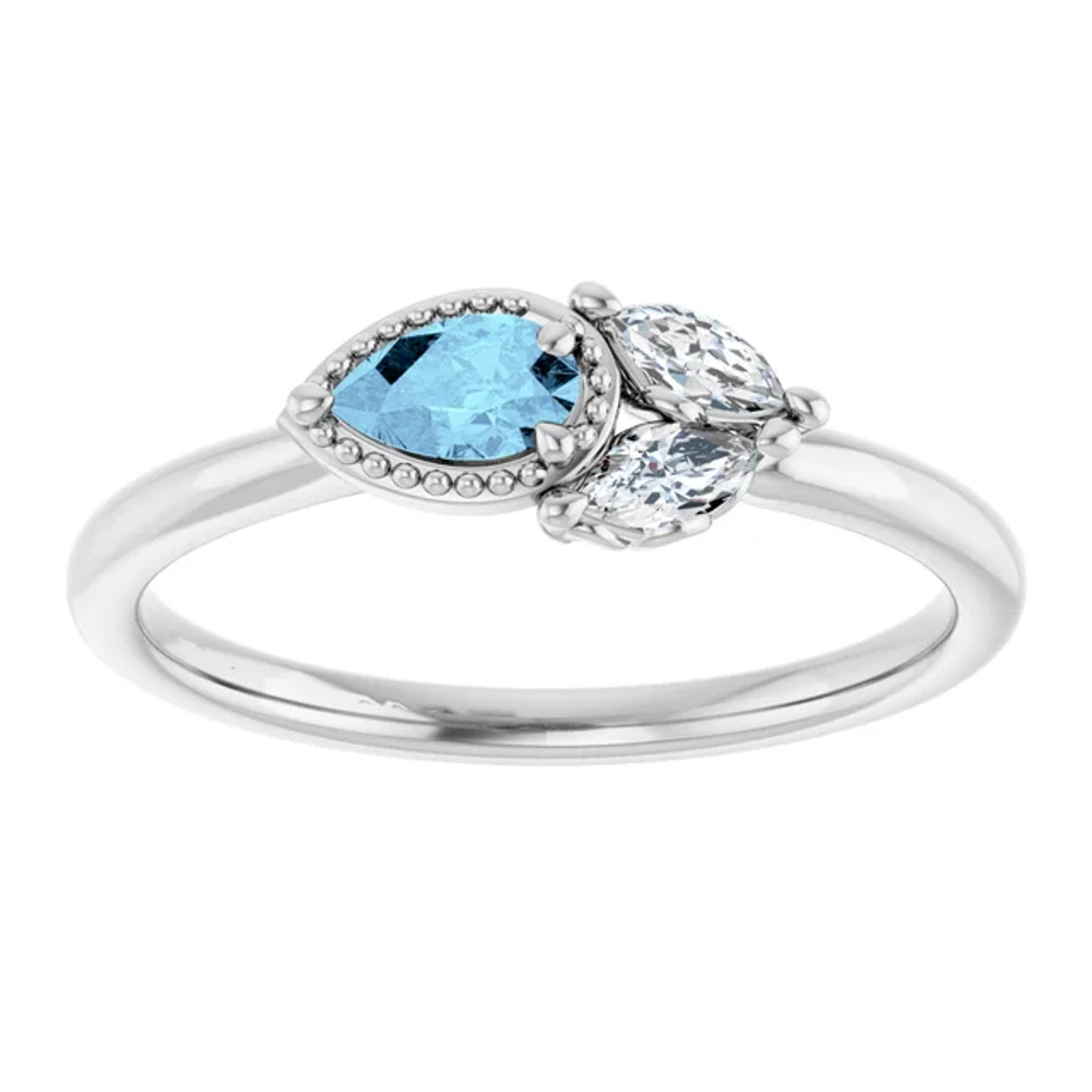 Dainty and feminine, this gemstone ring sets an elegant tone. The ring is set in platinum.