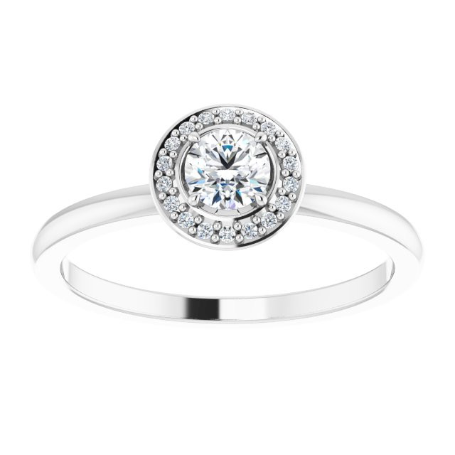 An unforgettable look, this dazzling diamond halo style ring simply captivates.