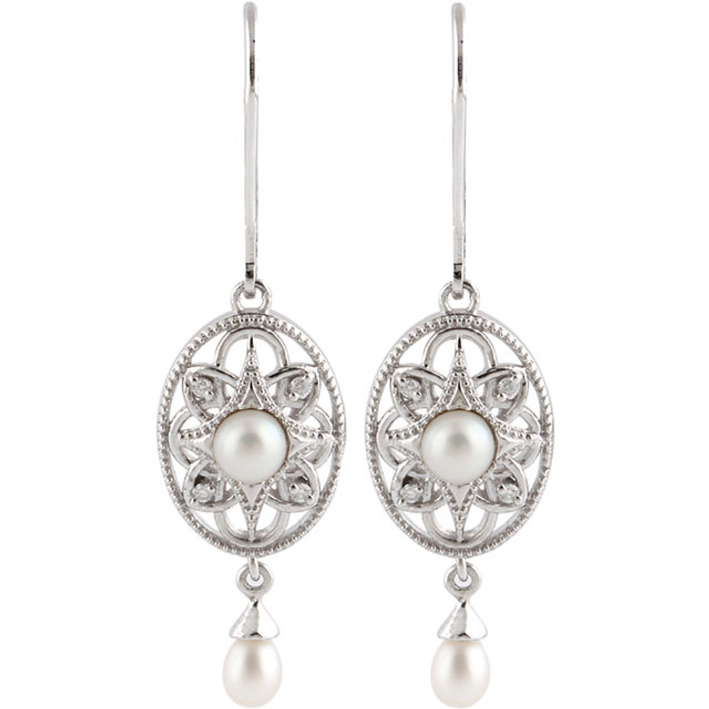 These lovely sterling silver earrings each feature a 4.0mm freshwater cultured pearl gemstone. Diamonds are .05 ct. tw. and I2 in clarity. Earrings are 38.20mm in length and 10.08mm in width. Polished to a brilliant shine.