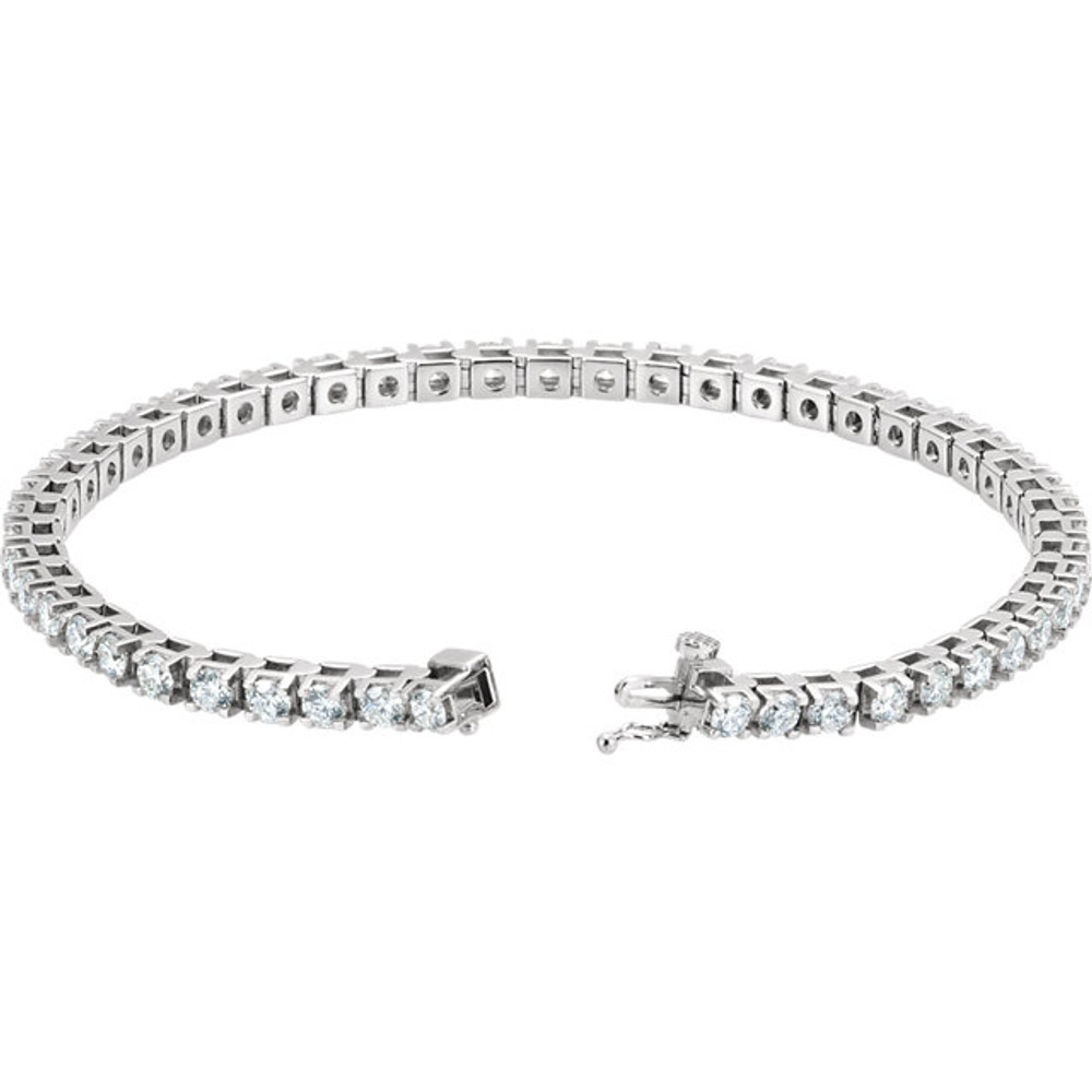 Elegant and refined, this diamond bracelet is a winner all around. Beautifully crafted in platinum, this stunning style is prong-set with an amazing 5 cts. t.w. of 50 shimmering round diamonds, each with a color ranking of G-H and a clarity of SI1. An exceptional design, this bracelet measures 7 1/4 inches in length and secures with a tongue and groove clasp. 