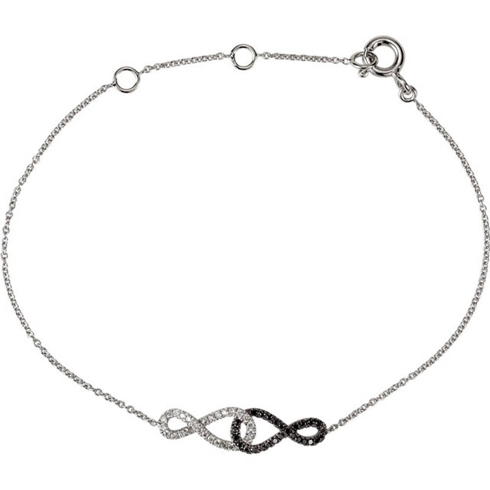 Infinitely elegant, this lovely Black & White Diamond Infinity fine bracelet makes a stirring statement of style. Created in 14K white gold, this eye-catching infinity symbol-shaped design is completely outlined with a brilliant array of black & white diamonds. Simple yet striking, this design suspends centered along an 5.75 - 6.75-inch adjustable chain that secures with a claw clasp.