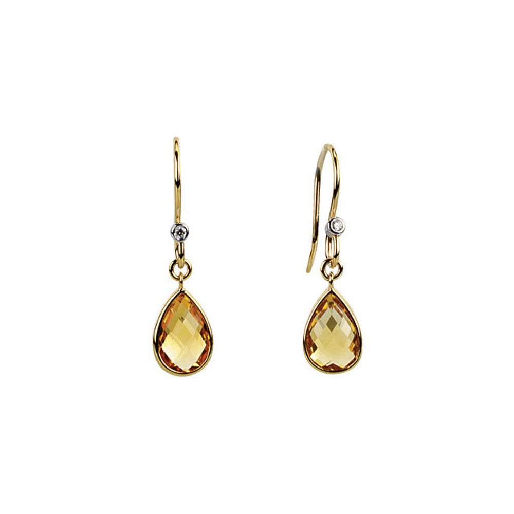 Elegant and dramatic, these captivating drop earrings are a statement look any woman would adore. Fashioned in 14K yellow gold, each  earring showcases a 09.00x06.00mm citrine gemstones. The drop is adorned with two shimmering diamond accents and polished to a fine shine, making this romantic gift the perfect birthday surprise.