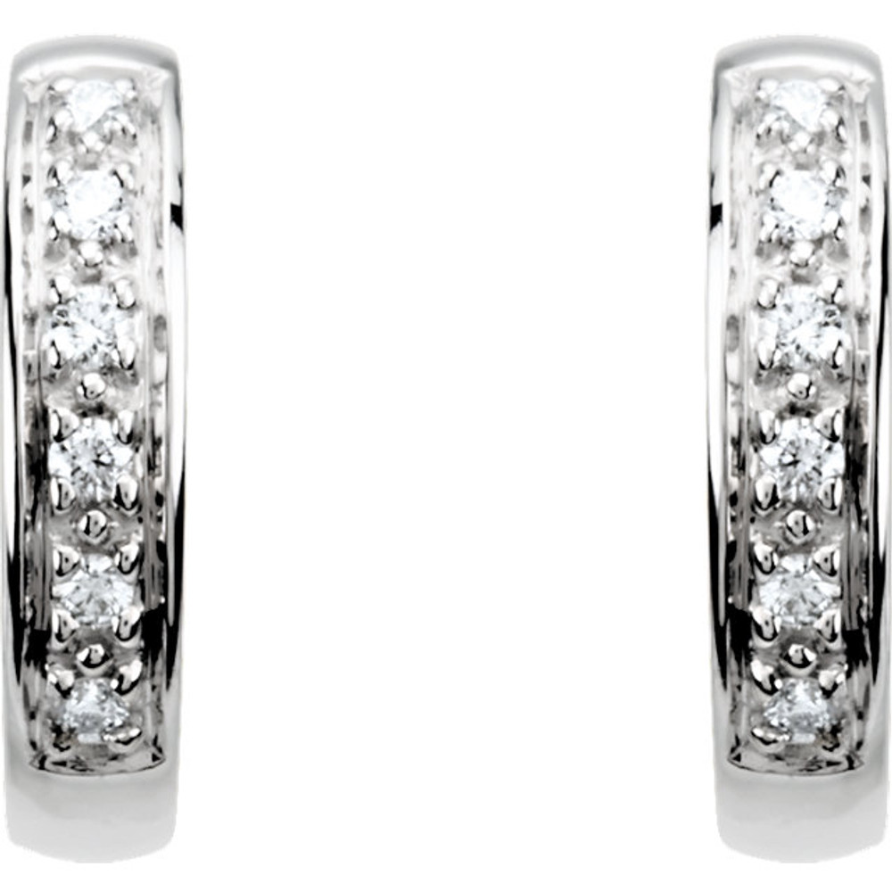 The classic hoop earring has been given a dazzling update. Fashioned in cool 14K white gold, these huggie hoop earrings sparkle with a row of shimmering round diamonds aligned down the front. A great look with any attire, these hoops captivate with 1/10 ct. t.w. of diamonds and a bright polished shine. The hoops secure with hinged backs.