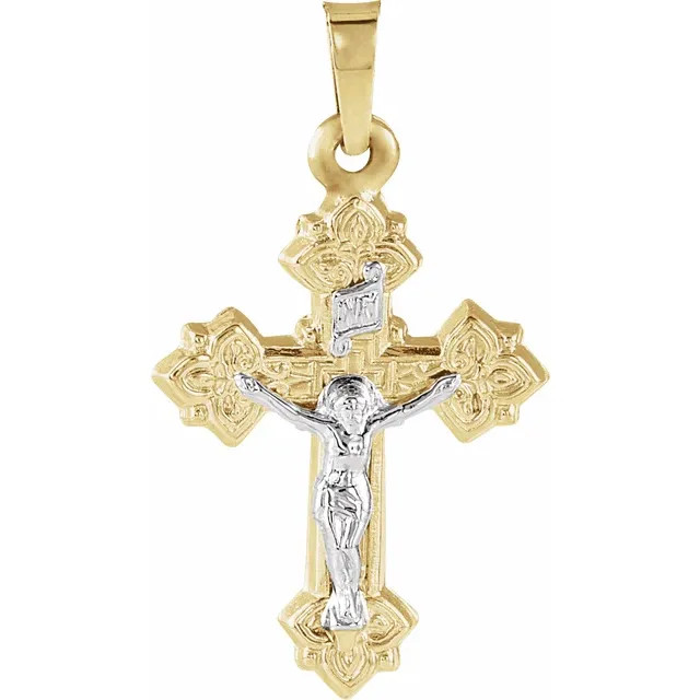 A delightfully design, this crucifix charm is a meaningful look of faith. Fashioned in 14K Yellow/White Gold, this design features an intricate filigree cross in warm yellow gold cross topped with a sculpted icon of the crucified Christ in bright white gold. A meaningful look, designed to be treasured, this charm is polished to a brilliant shine.