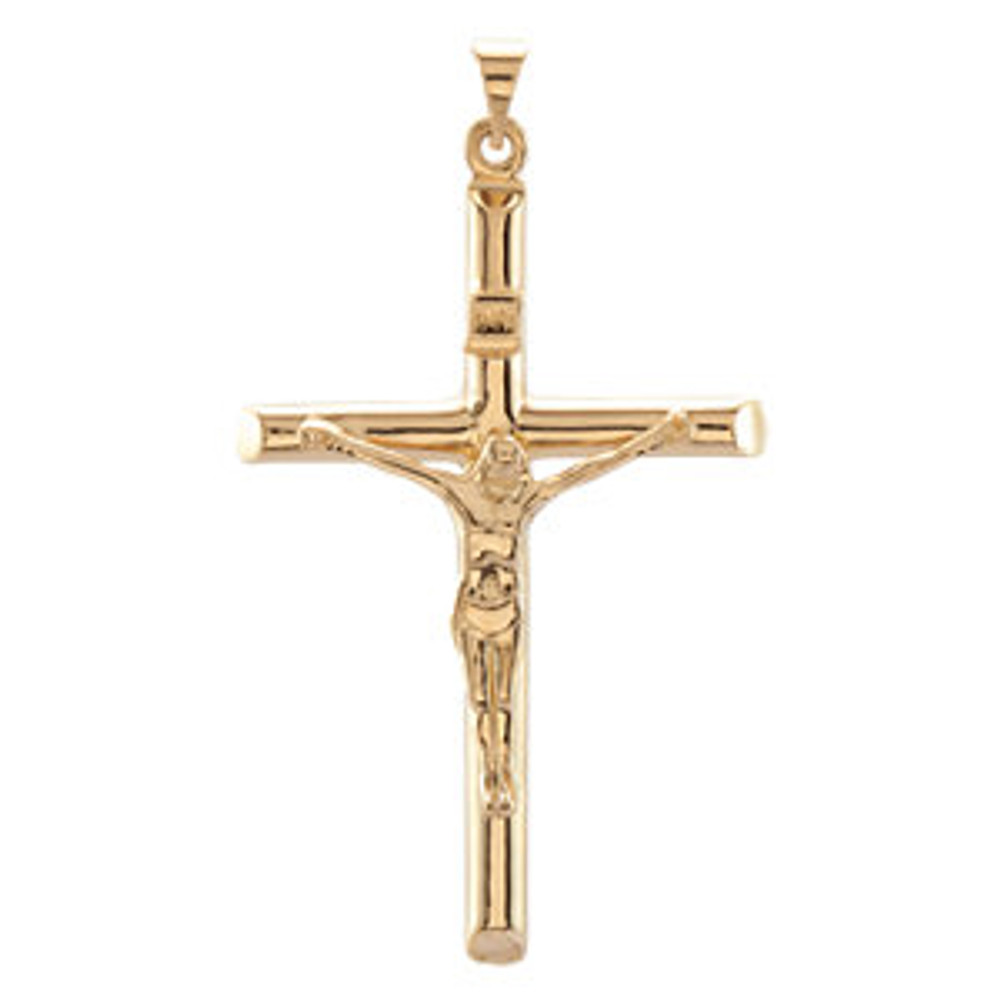 Faith meets fashion in this striking crucifix pendant. This crucifix pendant is in 14k yellow gold and measures 43.00x29.00mm. Polished to a brilliant shine.