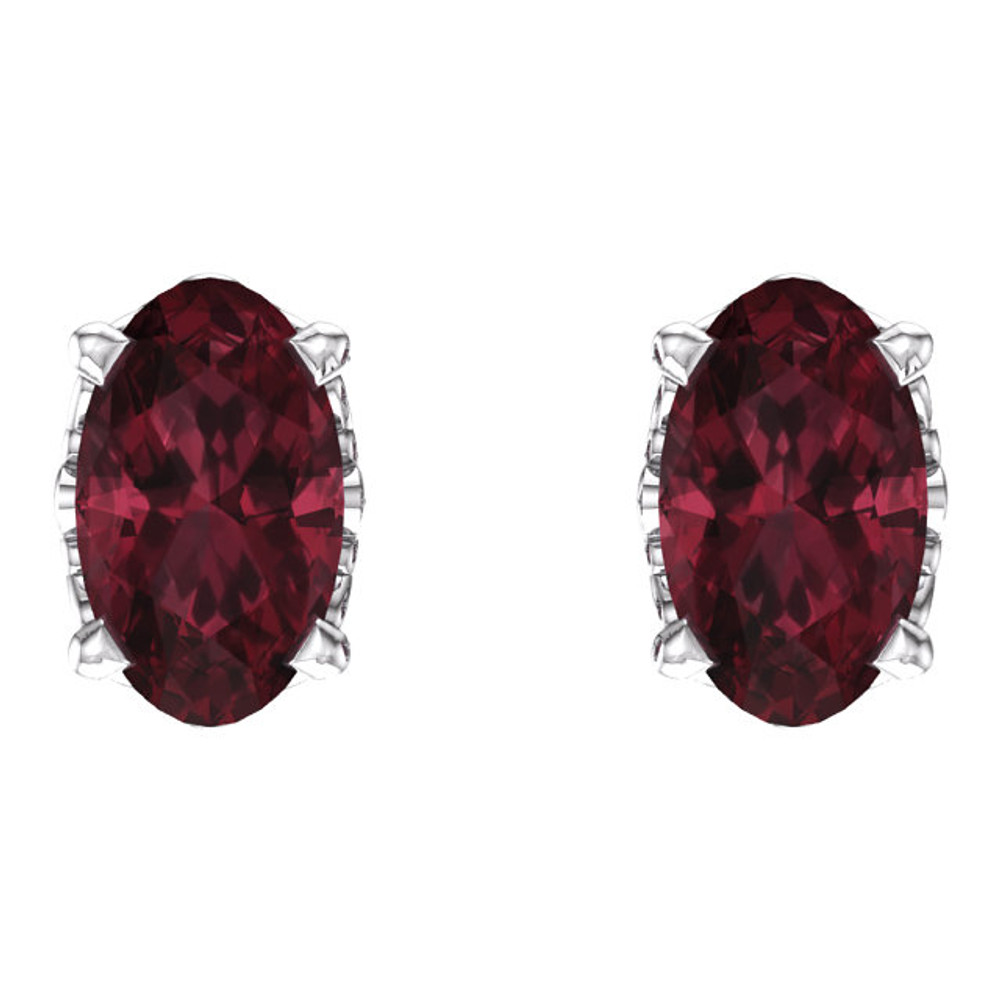 Mozambique Garnet, glowing deep red with hints of orange and brown offers a sophisticated yet organic look. This simple stud design features a 5 x 3mm faceted genuine garnet cradled in a 4-prong basket of 14k white gold finished with a tension back post. Total carat weight for the pair is 0.60. Color range varies on all natural stones so please allow for slight variations in shades. Gemstone treatment: Natural, not enhanced.