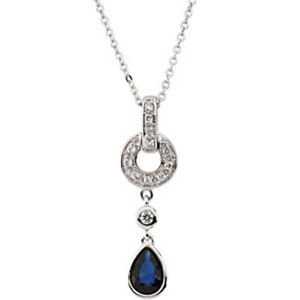 This enchanting 14k white gold pendant features a 6x4mm genuine pear cut blue sapphire. Diamonds are .08ctw, H in color, and I1 in clarity. Pendant is 18mm in length and 9mm in width. A 14k white gold 18 inch rolo chain is included.