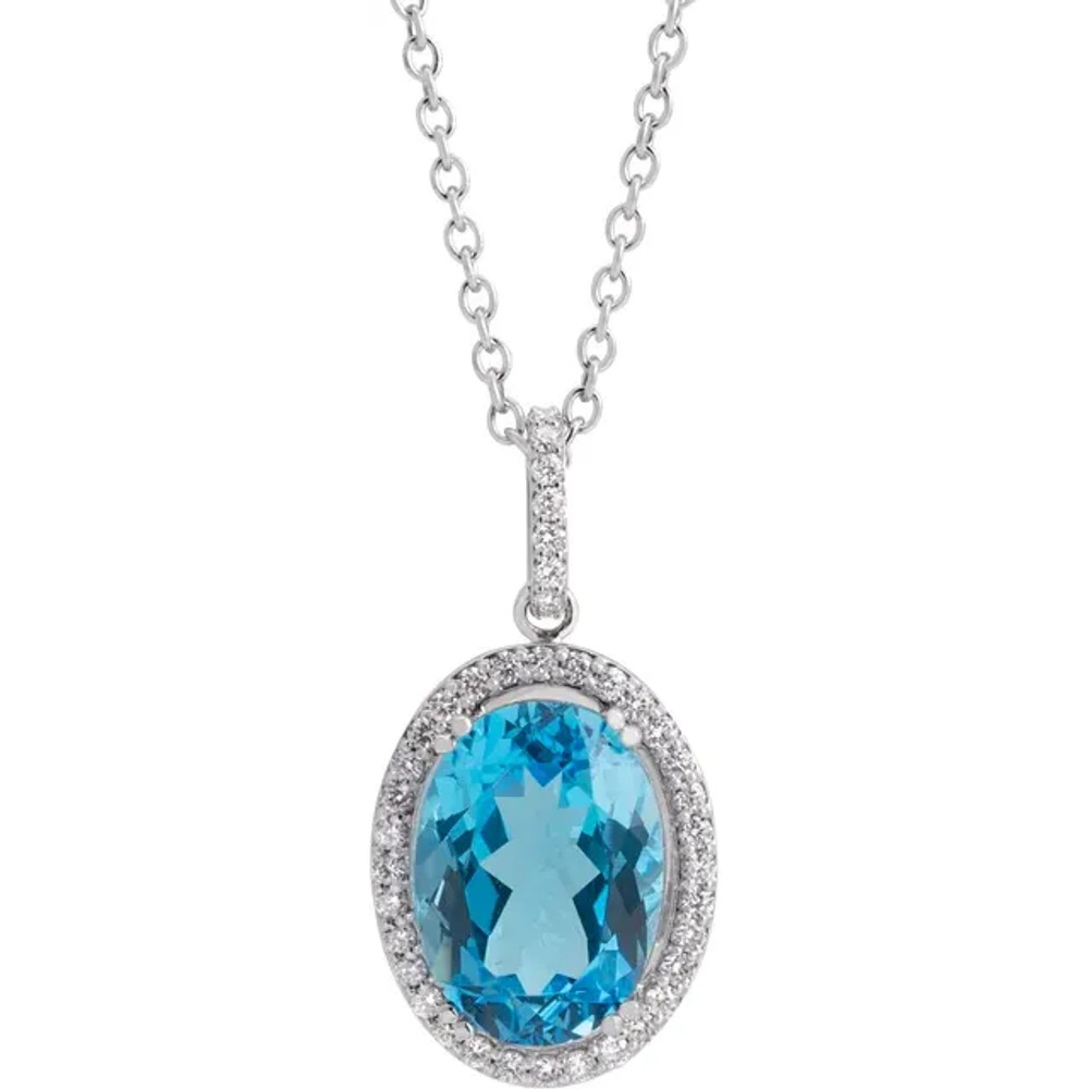 Turn your favorite birthstone into the most sophisticated look with this oval-shaped blue topaz and diamond frame pendant.