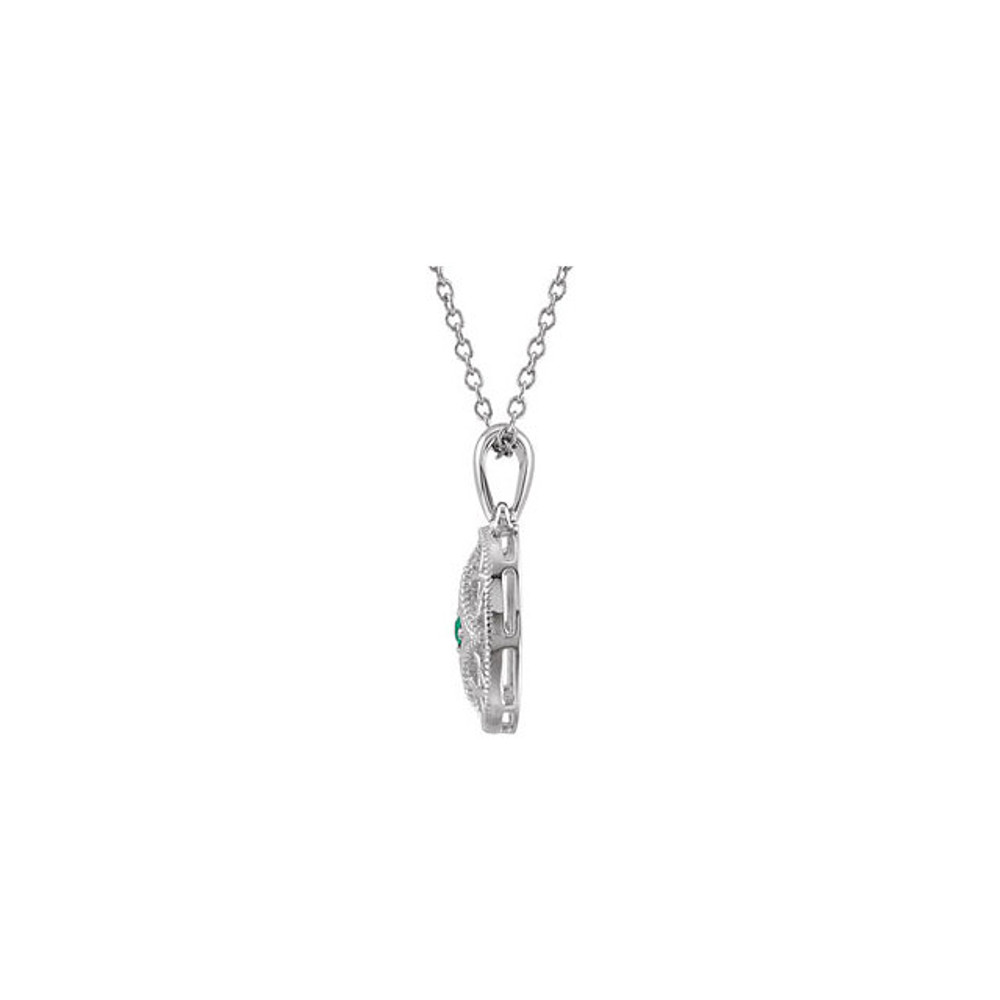 Treat her like a princess with this emerald vintage-style pendant in sterling silver. This one of a kind pendant proudly displays one sparkling emerald gemstone surrounded by round-cut diamonds.